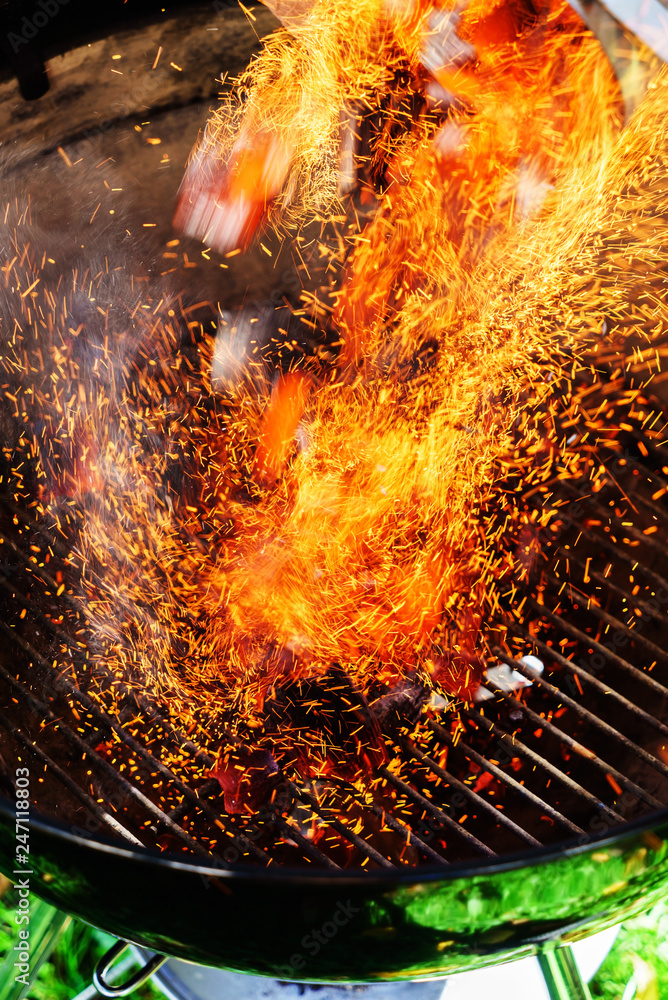 Naklejka premium Burning coals of wood as a background