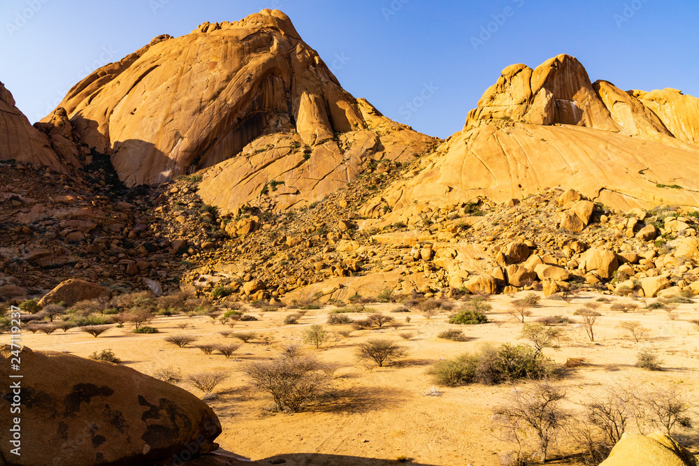 Obraz premium Camping site at Spitzkoppe mountains in the Namib desert near Swakopmund, Namibia Africa at evening