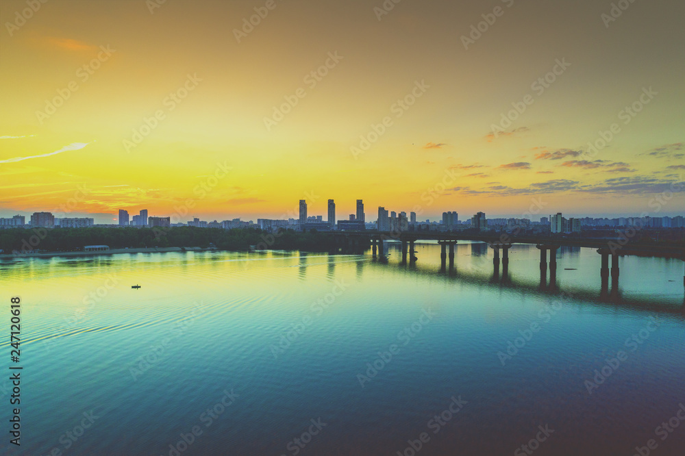 Skyline, Kiev city in the morning, Paton bridge. Left bank of the Dnieper River. Aerial view Skyline, Kiev city in the morning, Paton bridge. Left bank of the Dnieper River. Aerial view