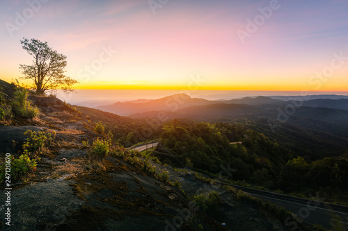 Fototapeta Naklejka Na Ścianę i Meble -  Beautiful winter sunrise landscape viewpoint at km.41 of Doi Inthanon Chiang Mai Thailand. Scenic view of Doi Inthanon National Park in Chom Thong District, Chiang Mai Province, Northern Thailand.