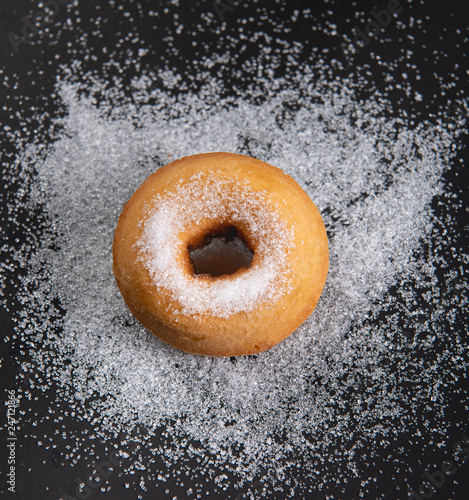 Donut sprinkled with sugar. Donut sprinkled with Granulated sugar