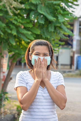 Asean Woman wear a mask to prevent dust in Bangkok ,Thailand.
