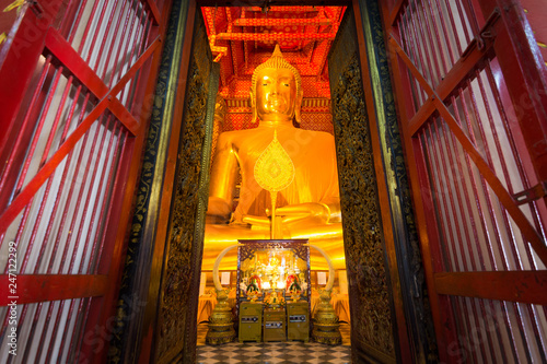 Big Buddha statue in Wat Phananchoeng temple with Church arch Ayuthaya, Thailand. photo