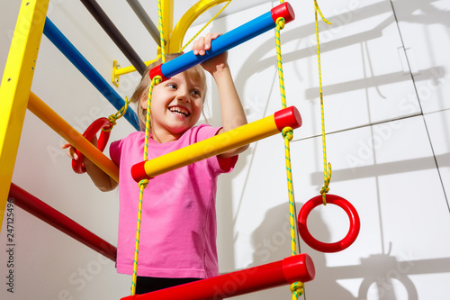 8 years old child playing on sports equipment