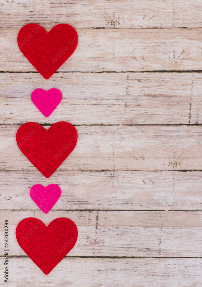 White Saint Valentine's day background with red and pink hearths, vertical card orientation, copy space White Saint Valentine's day background with red and pink hearths, vertical card orientation, copy space