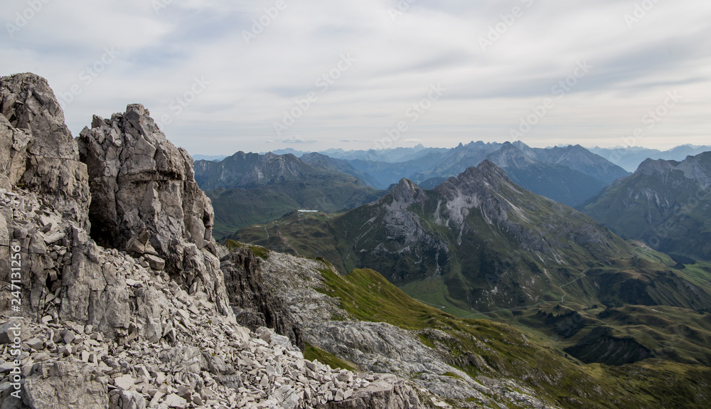 Panoramic view in the alps with boulders in the foreground. Near Lech, Austria.