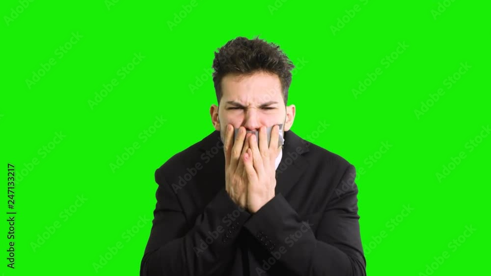 Businessman unable to talk isolated on green screen Businessman unable to talk isolated on green screen