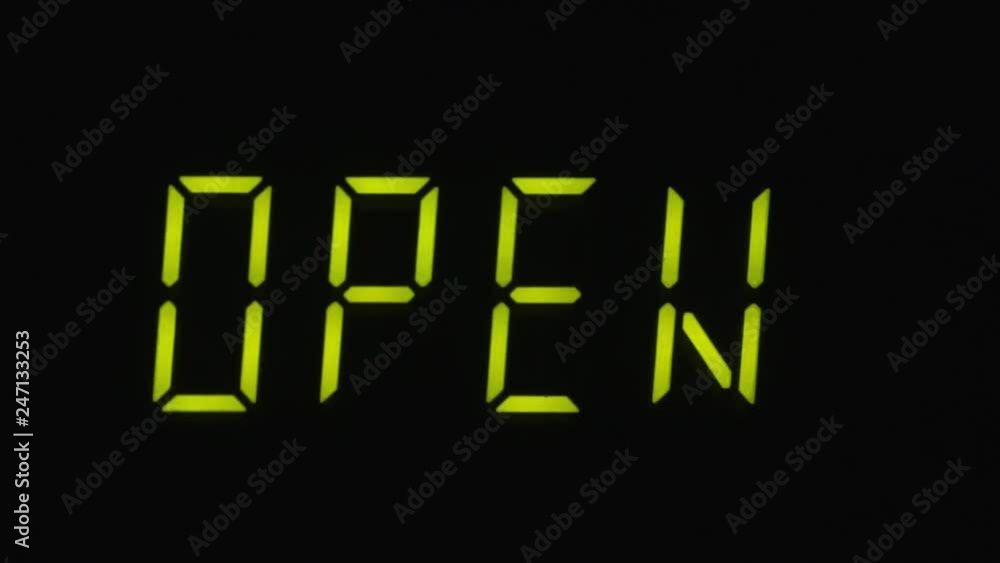 Blinking inscription OPEN on the digital screen. Concept Blinking inscription OPEN on the digital screen. Concept