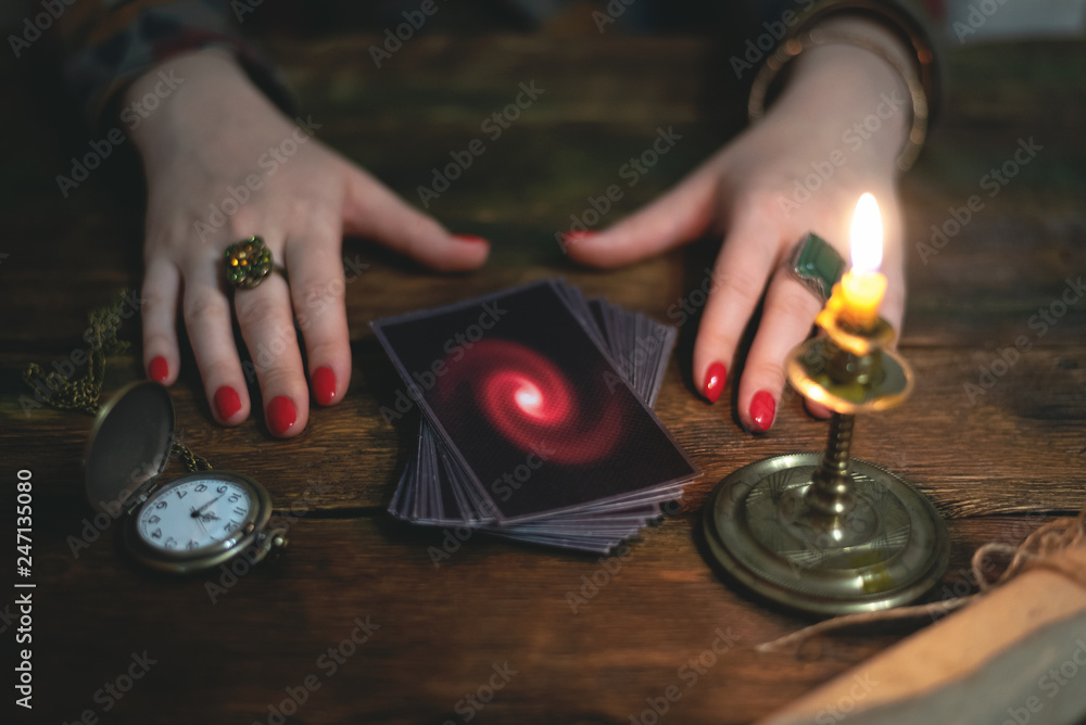 Tarot cards and a woman fortune teller. Future reading concept. Divination. Tarot cards and a woman fortune teller. Future reading concept. Divination.