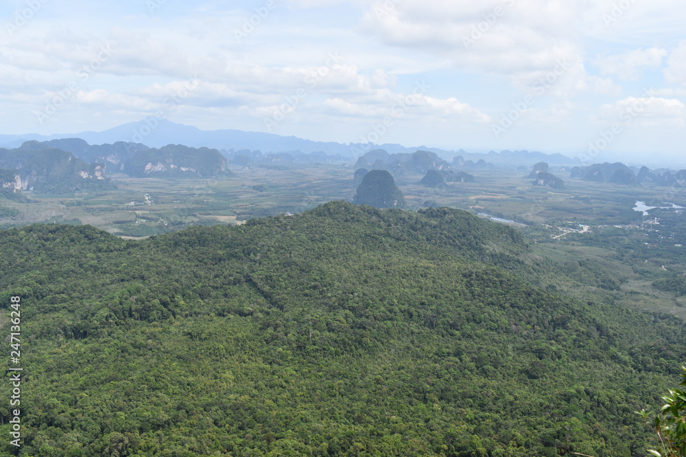Fototapeta premium Panorama view from a big rock over Krabi at the jungle hiking trail to dragon crest in Khao Ngon Nak in Krabi, Thailand, Asia