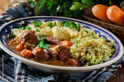 Traditional irish stew served with potatoes and cabbage
