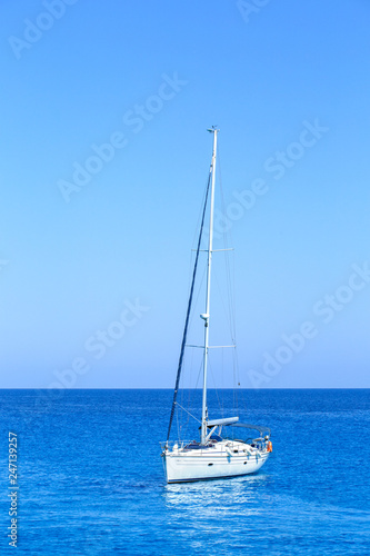 Sailboat At Open Sea. Vertical images. © Sergey