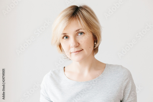 Middle aged woman on light background