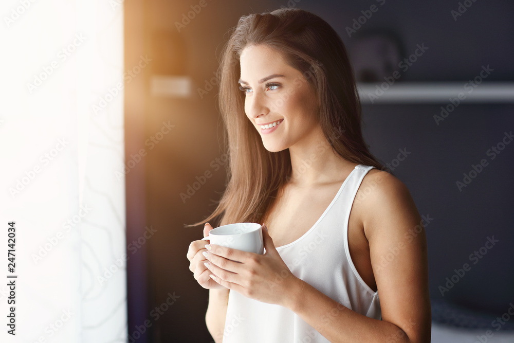 Young beautiful woman waking up in her bed fully rested Young beautiful woman waking up in her bed fully rested