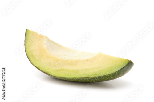 Slice of avocado isolated