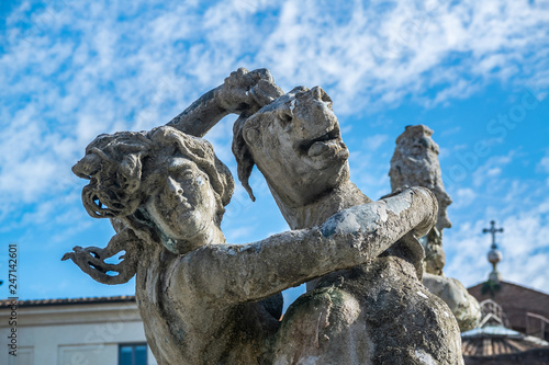 Fontana delle Naiadi statue of a woman holding a horse at piazza della repubblica in Rome, Italy