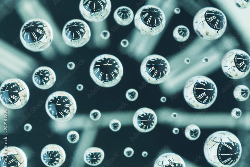 Reflections of old pocket watch in multiple small water drops Reflections of old pocket watch in multiple small water drops