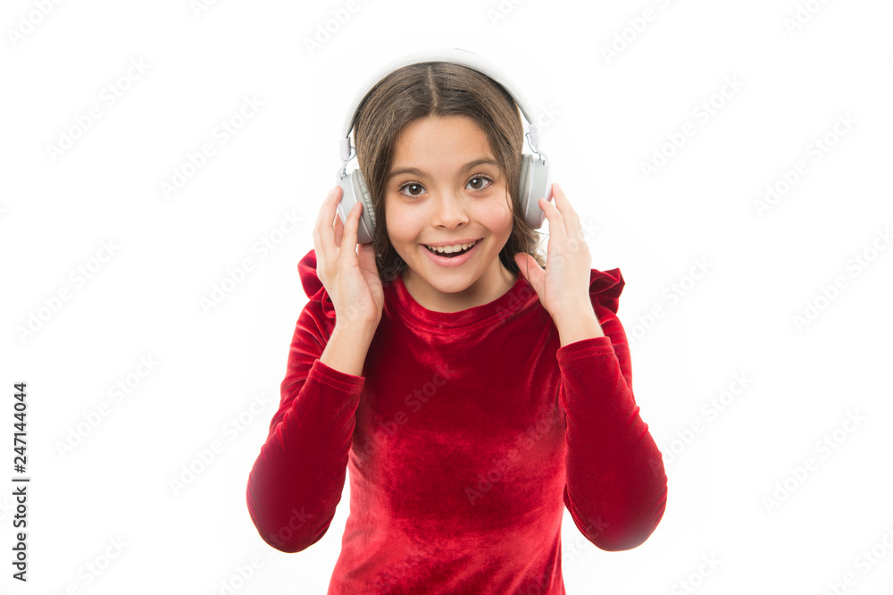 Time to relax. small child in headphones. music. listening ebook. audio education. happy childrens day. childhood and happiness. kid fashion and beauty. small girl in red dress