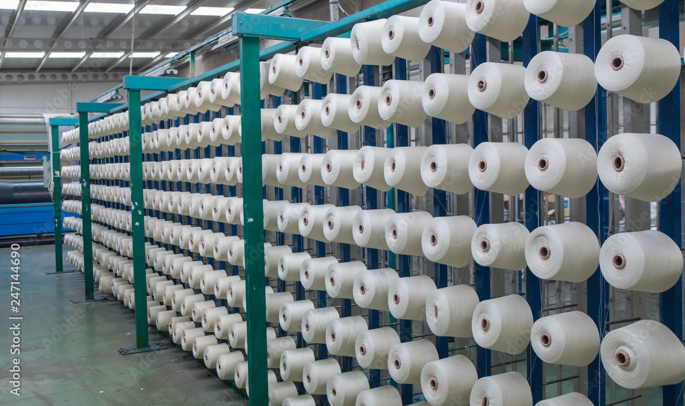 Group of bobbin thread cones on a warping machine in a textile mill. Yarn  ball making