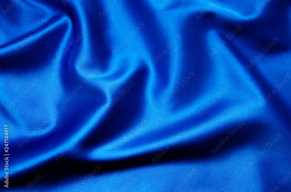 Smooth elegant blue silk can use as background Smooth elegant blue silk can use as background