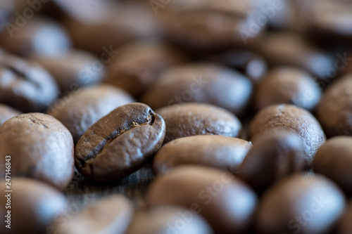 close up of coffee beans on wood table