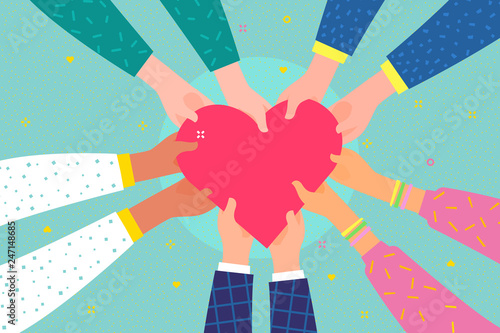 Charity concept. Several people hold the heart