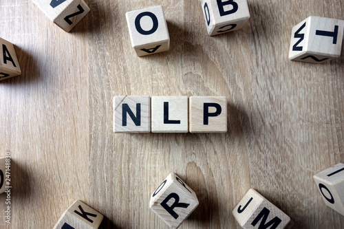 NLP word from wooden blocks on desk photo