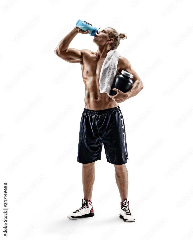 Strong man drinks protein cocktail after training. Photo of sportsman with big jar of sports nutrition isolated on white background. Resting time. Full length Strong man drinks protein cocktail after training. Photo of sportsman with big jar of sports nutrition isolated on white background. Resting time. Full length