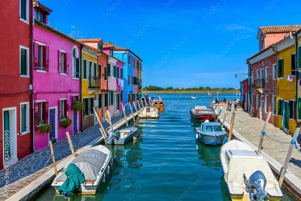 Street with colorful buildings in Burano island, Venice, Italy. Architecture and landmarks of Venice, Venice postcard