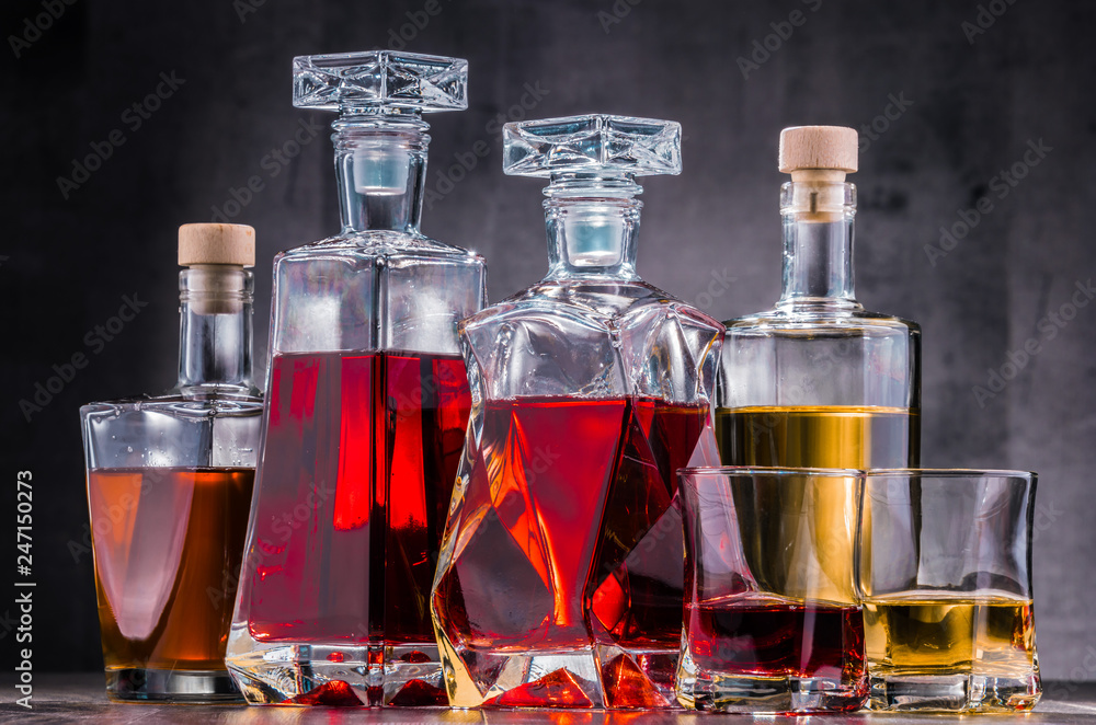 Carafe and bottles of assorted alcoholic beverages. Carafe and bottles of assorted alcoholic beverages.