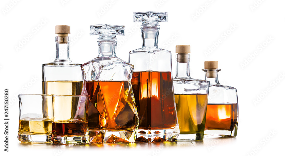 Carafe and bottles of assorted alcoholic beverages. Carafe and bottles of assorted alcoholic beverages.