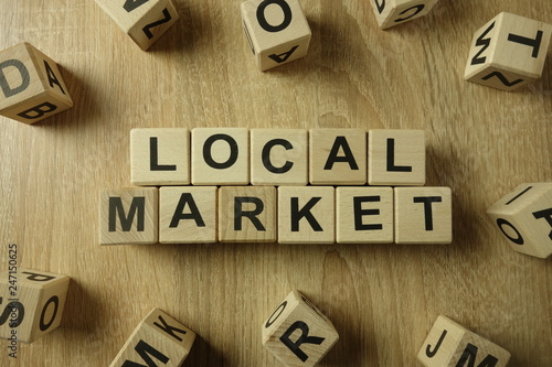 Local market text from wooden blocks on desk