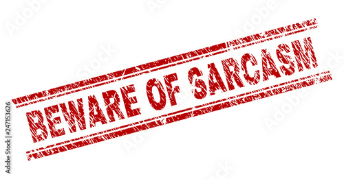BEWARE OF SARCASM seal print with grunge texture. Red vector rubber print of BEWARE OF SARCASM tag with unclean texture. Text label is placed between double parallel lines.