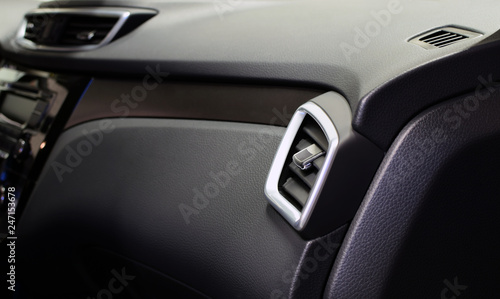 Modern car interior. Air ventilation  car glove box and dashboard. Copy space