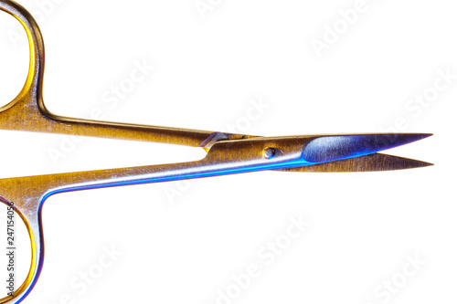 Manicure scissors isolated on a white background. Open nail scissors macro