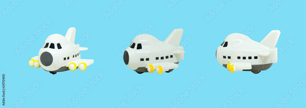 Fototapeta premium White small airplane toys isolated on blue background.