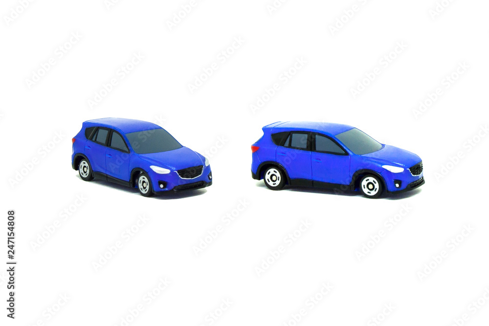 Close up blue car toys isolated on white background. (Selective focus)