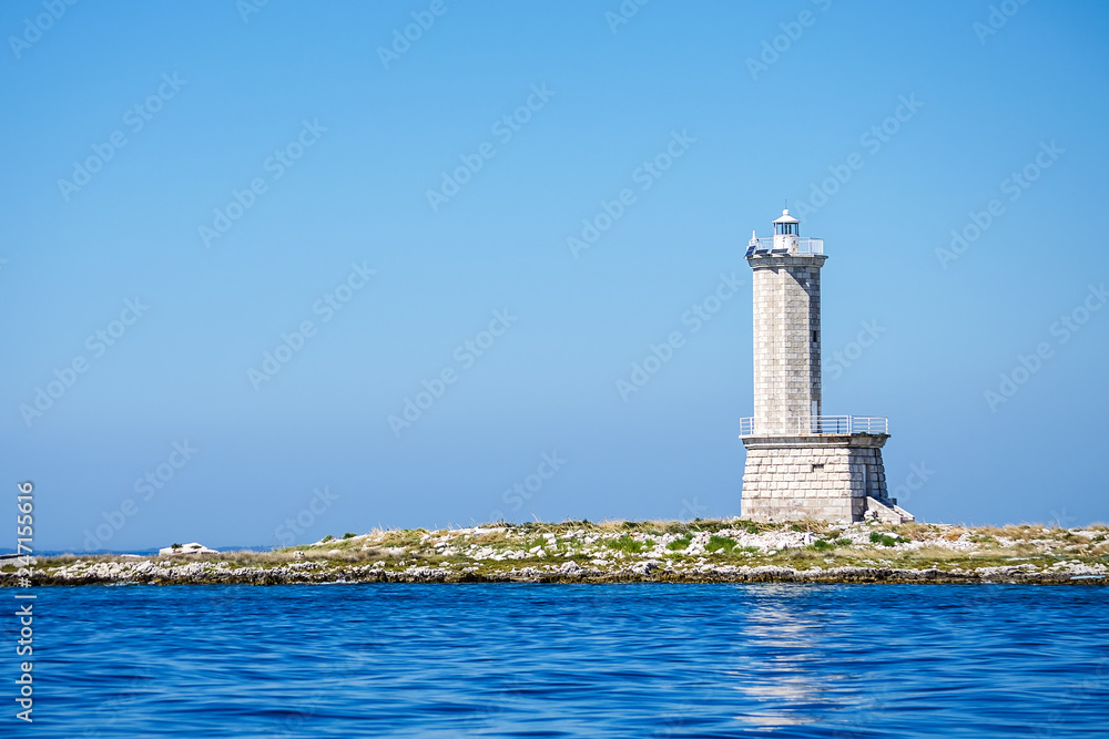 Beautiful old lighthouse against the blue sky. Architecture. Mar landscape.
