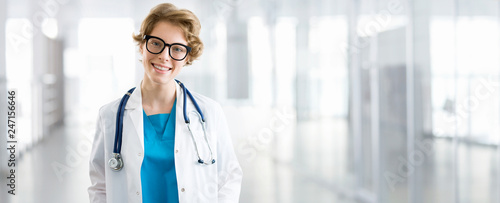 Young female doctor on modern clinic background. photo