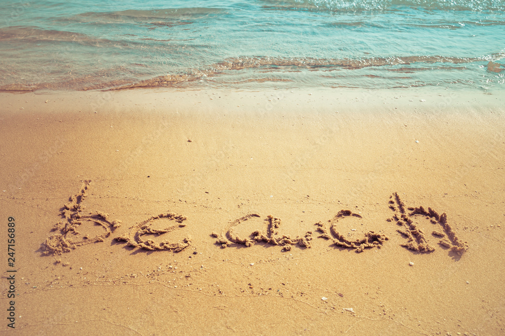Vacation on the sand beach concept. Beach words written into the sand on the beach at Rayong, Thailand. Vacation on the sand beach concept. Beach words written into the sand on the beach at Rayong, Thailand.