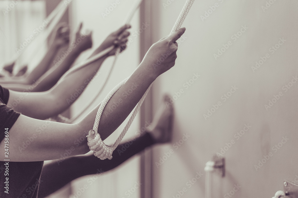 Young woman practicing yoga with namaste behind the back.working out, wearing sportswear.Calmness and relax, woman happiness. Toned picture