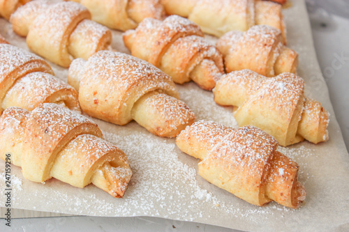 Cheese bagels with powdered sugar.