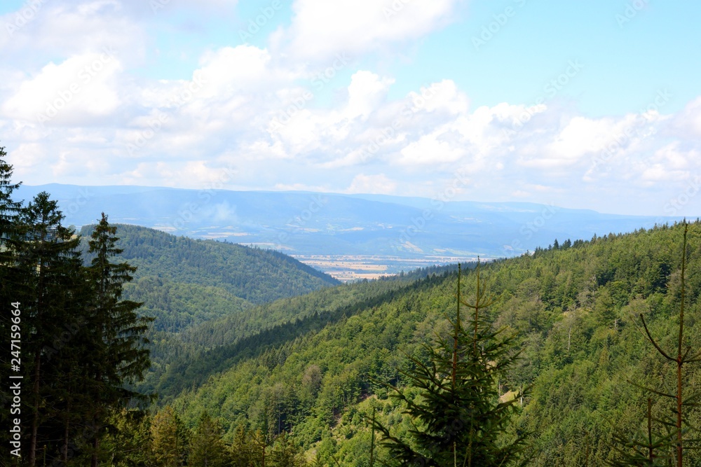 view of green mountains and sky view of green mountains and sky