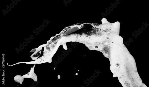 White bubble foam splash explosion in the air on black background,freeze stop motion photo object design photo