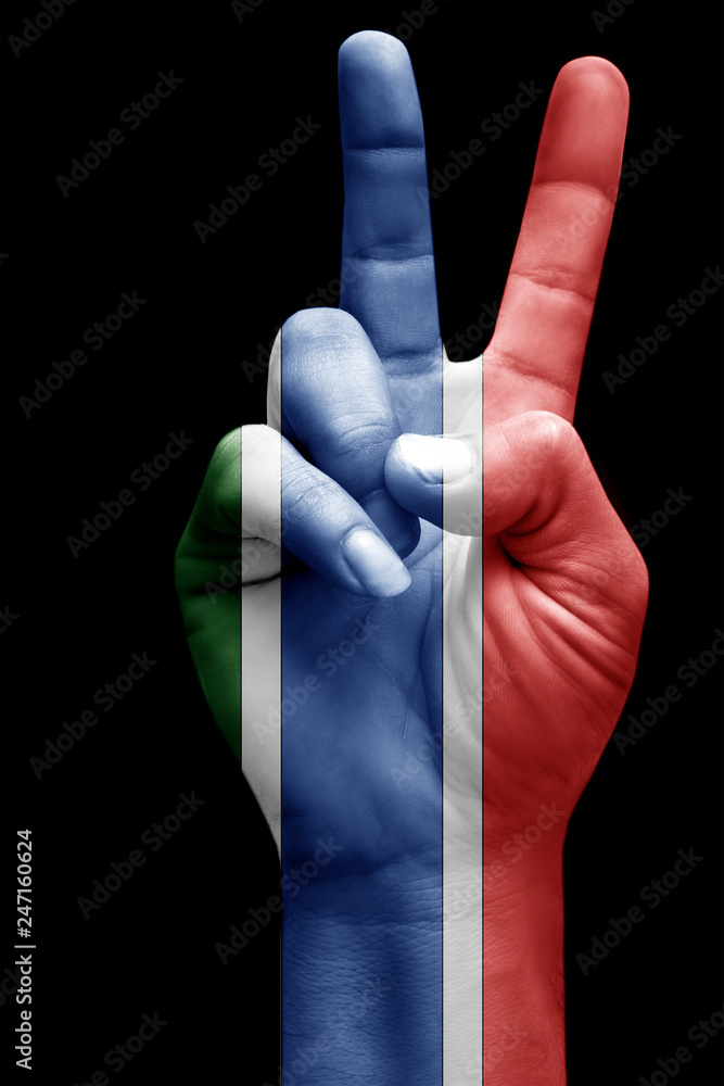 and making victory sign, Gambia painted with flag as symbol of victory, win, success - isolated on black background