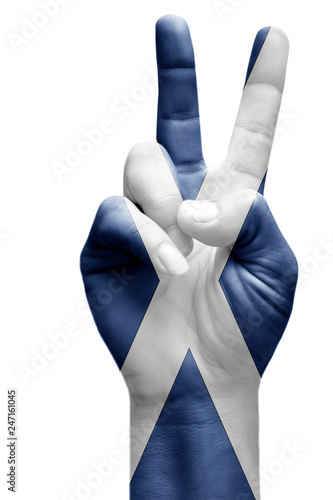and making victory sign, Scotland painted with flag as symbol of victory, win, success - isolated on white background © rauf