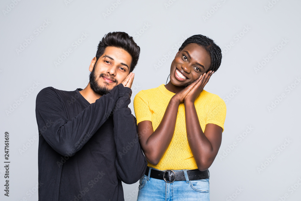 Φωτογραφία Interracial couple, indian man and african woman with sleep sign isolated on gra