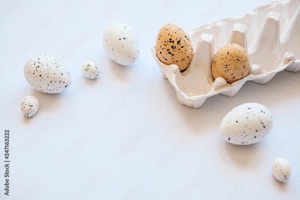 Obraz premium Set of eggs on a white background. Festive Easter background. Nearby there is a place for text.