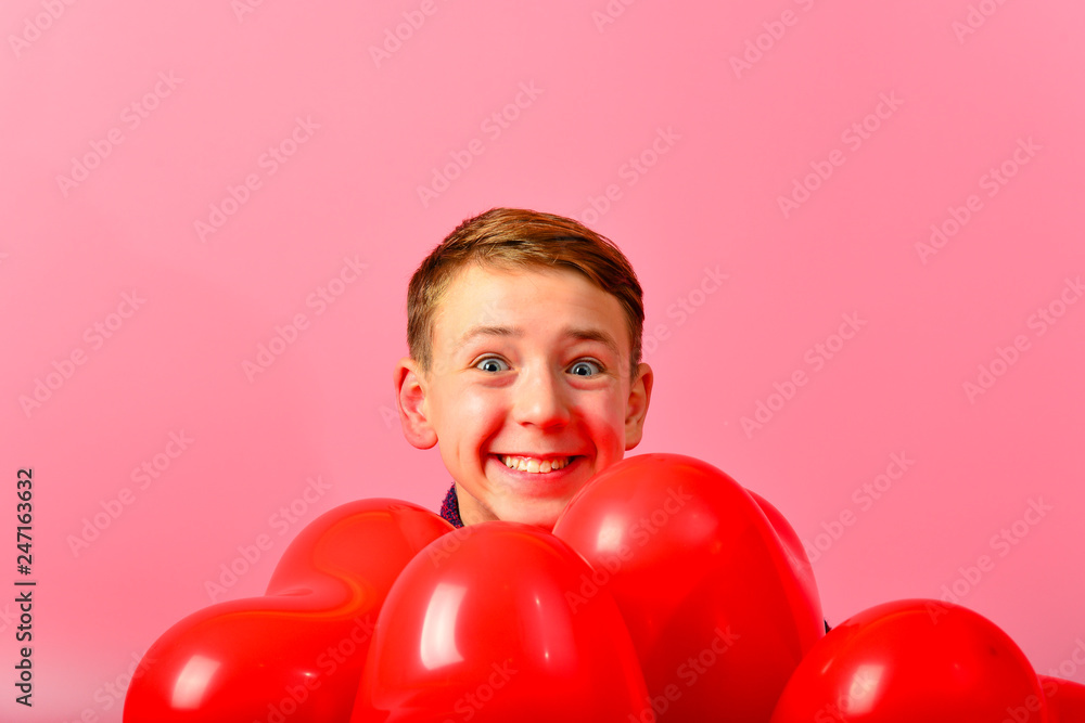 A smiling man gives valentines for the holiday of March 8. A smiling man gives valentines for the holiday of March 8.