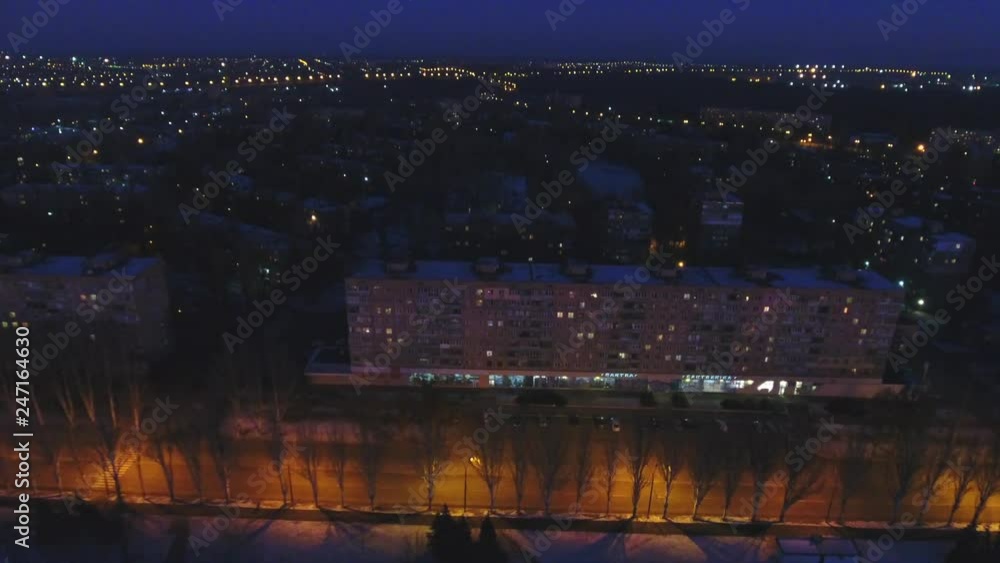 HD Drone aerial shot of the evening city, the closing up shoot to the residential building HD Drone aerial shot of the evening city, the closing up shoot to the residential building